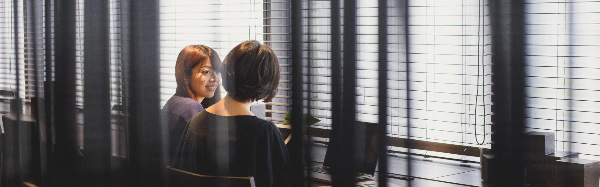 Insynq lady in black in meeting room image