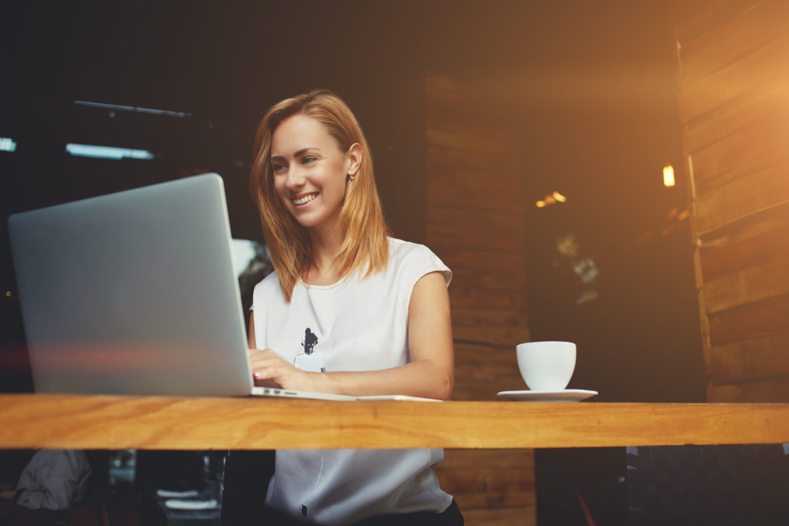 Insynq Girl with laptop and coffee in office image