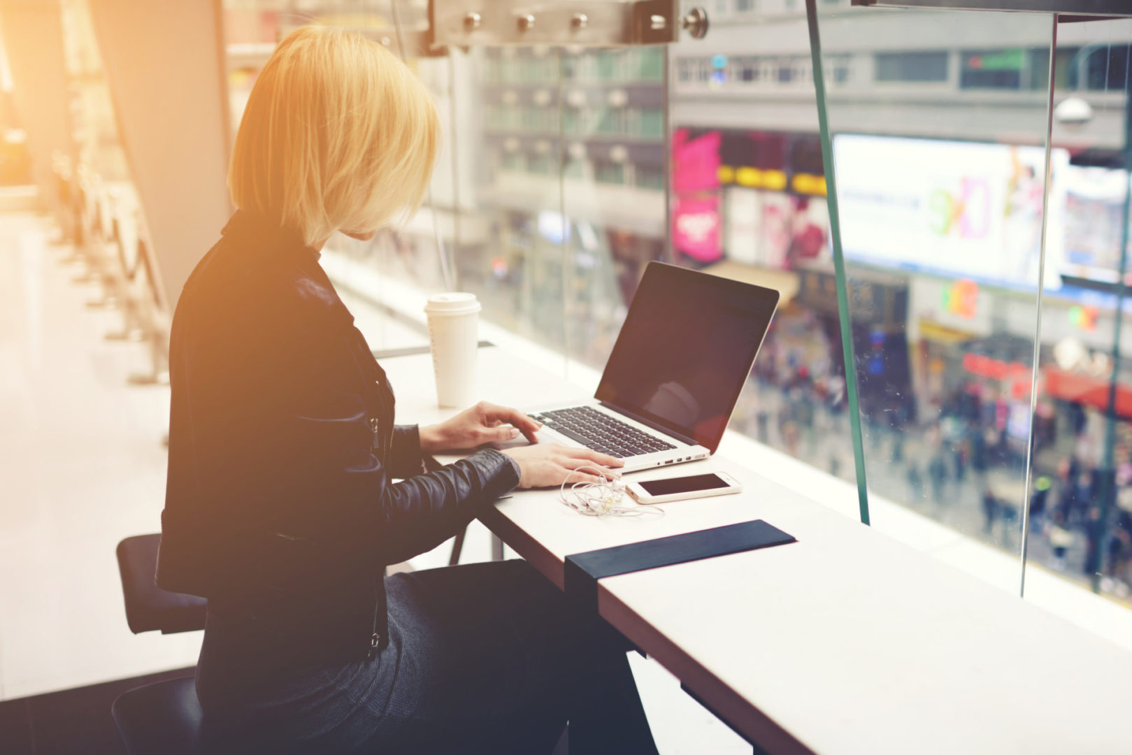 seize momentum, lady in black on laptop image