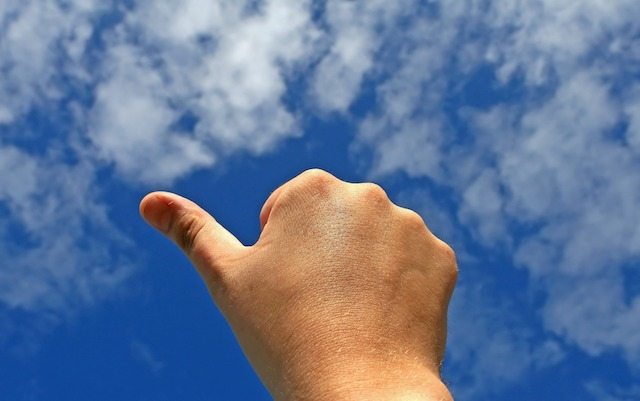 public vs private cloud, thumbs up in cloud sky image