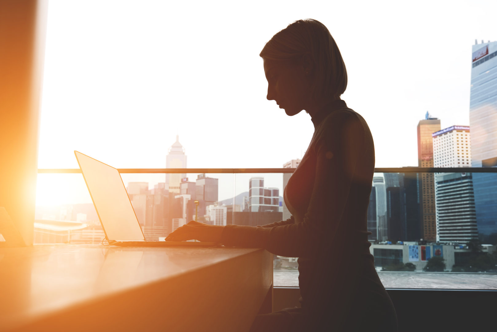 Insynq Evolving Cloud lady on laptop in sunlight image