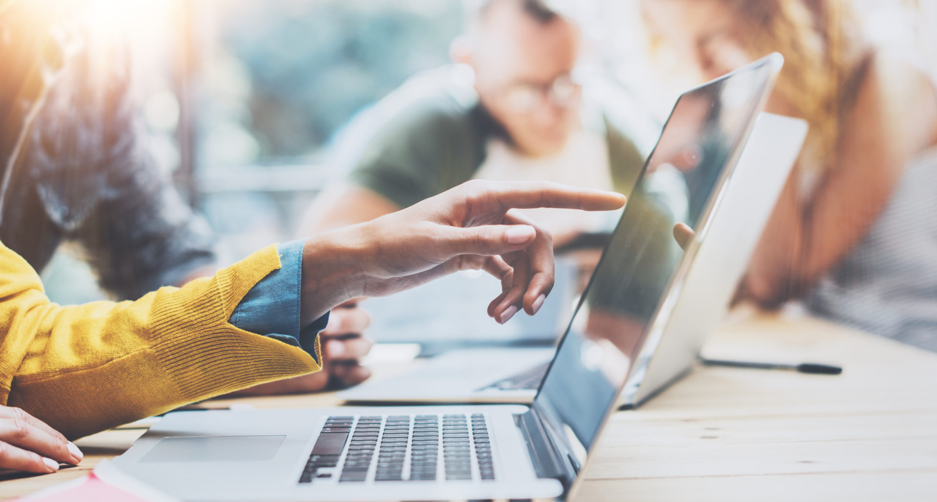 Cloud computing woman pointing at laptop screen image