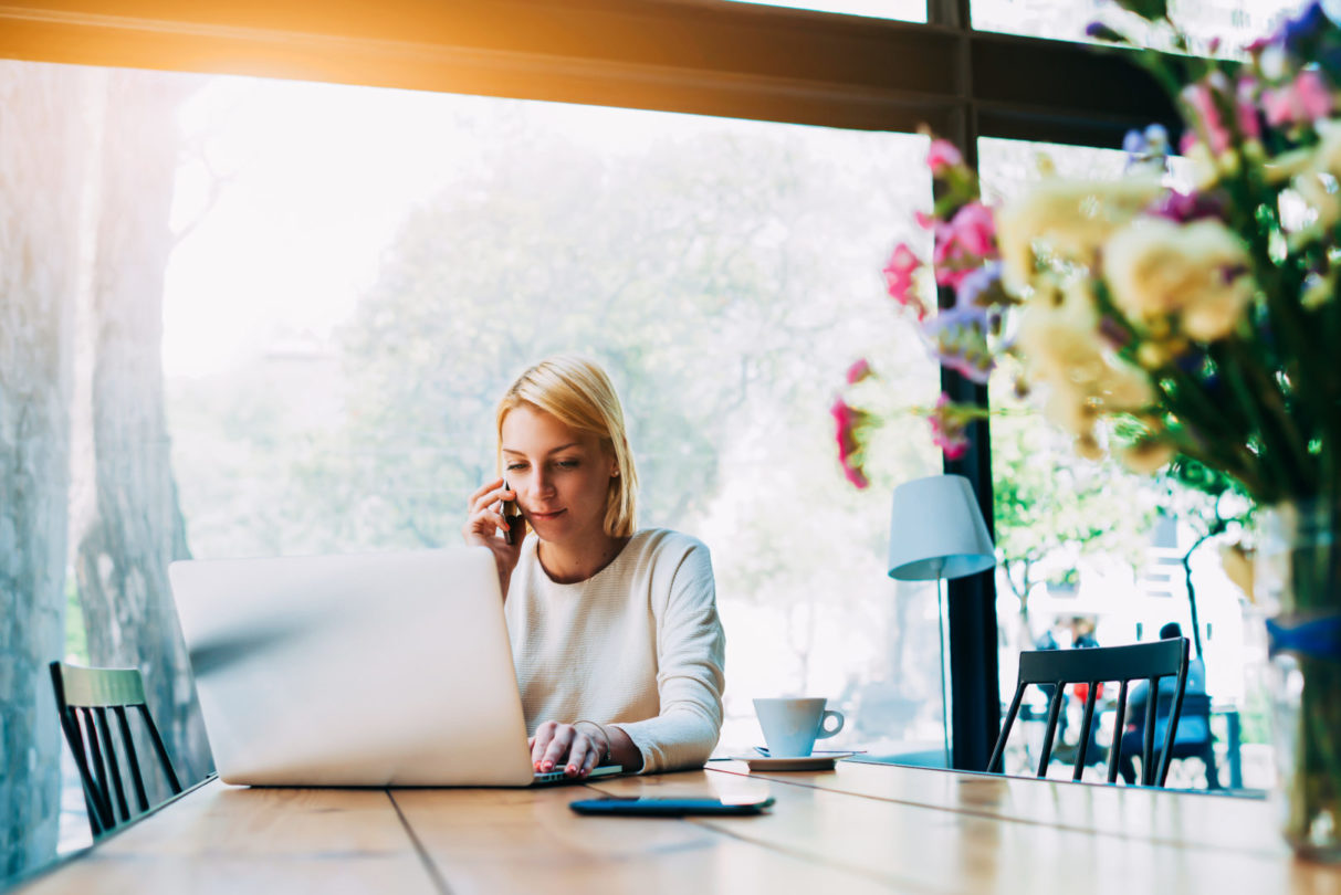 business girl on laptop with flowers image