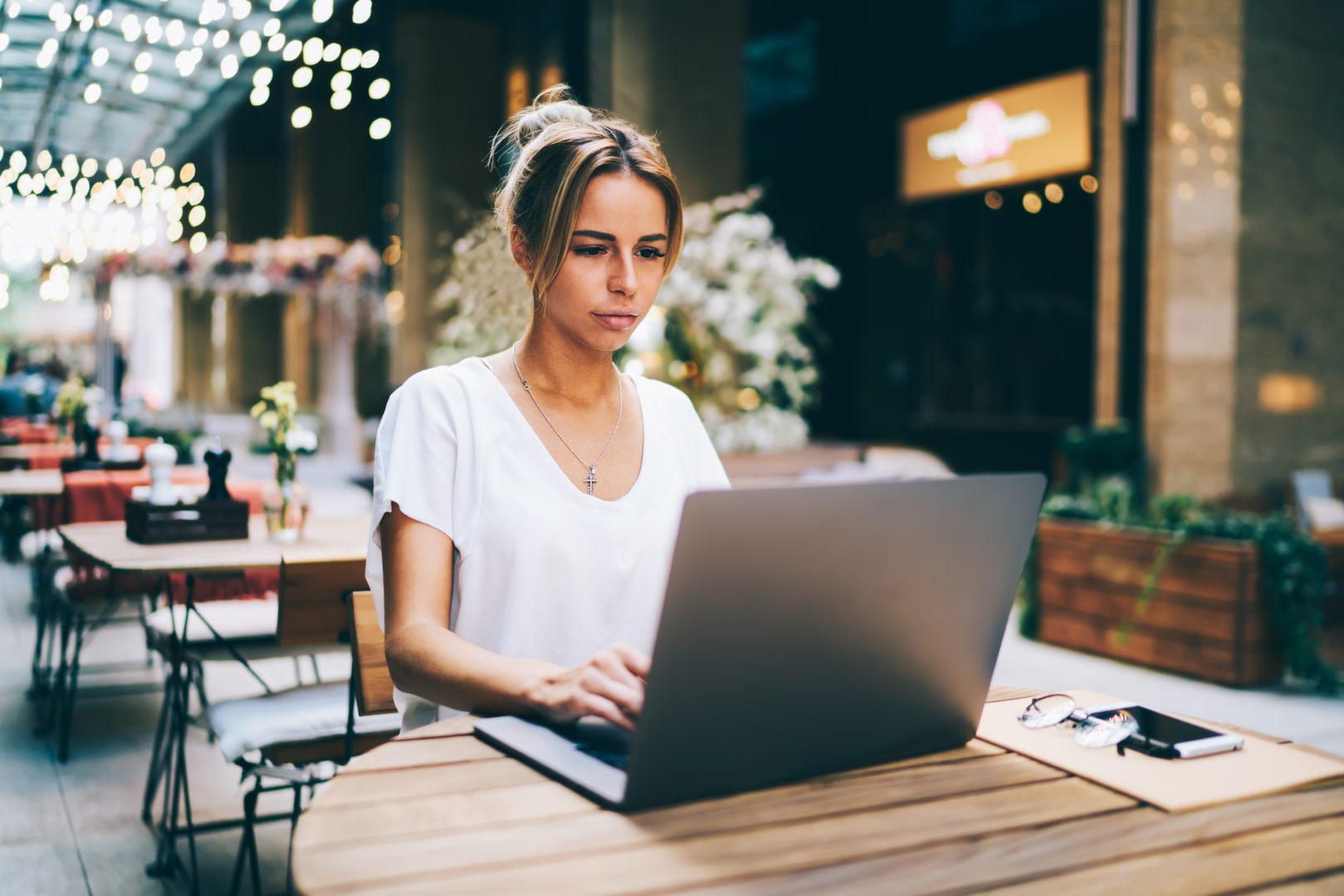 girl at table with laptop