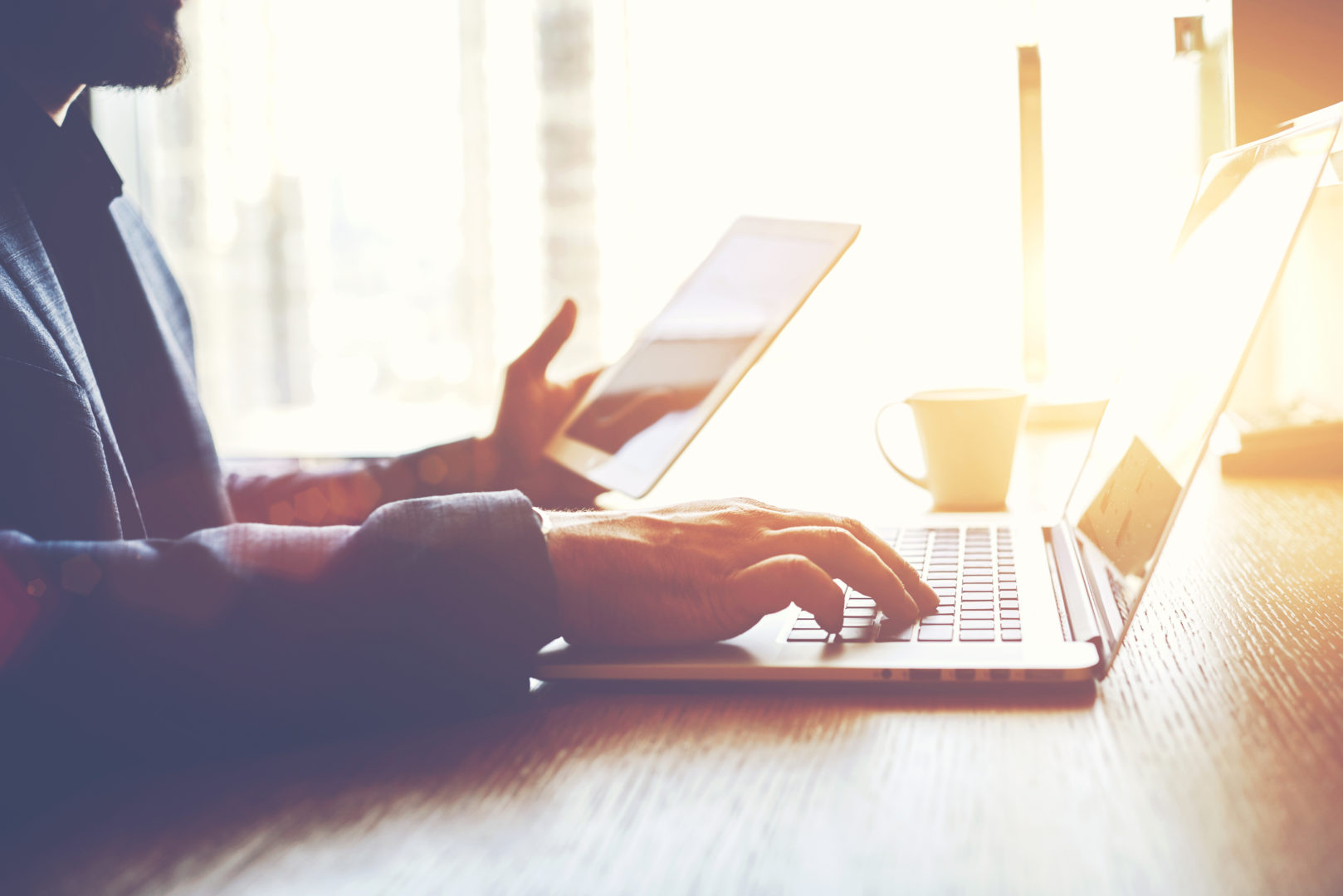 Virtual Desktop Infrastructure, man typing holding ipad image