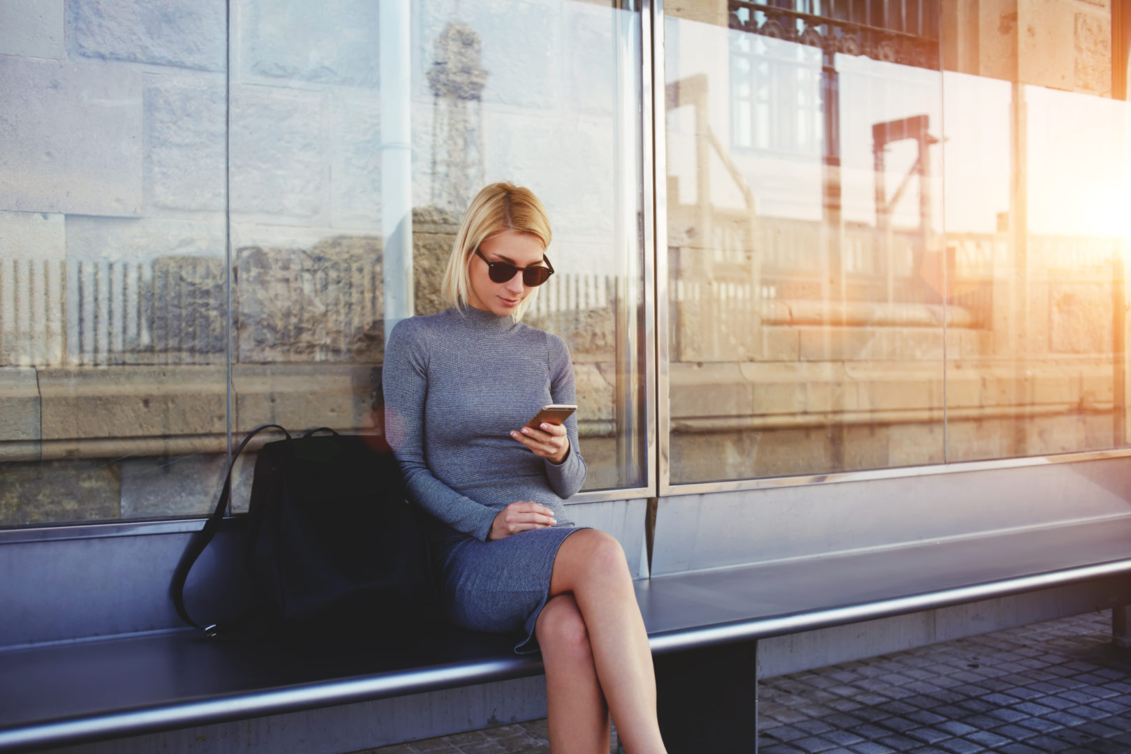 Benefits for Better Business Practices, woman on bench texting image